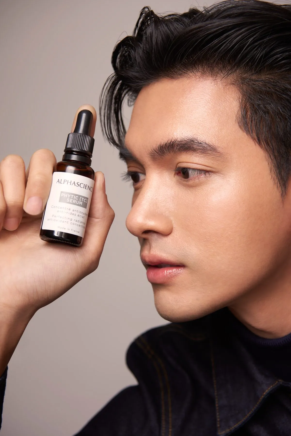 Skincare serum product photography with a model