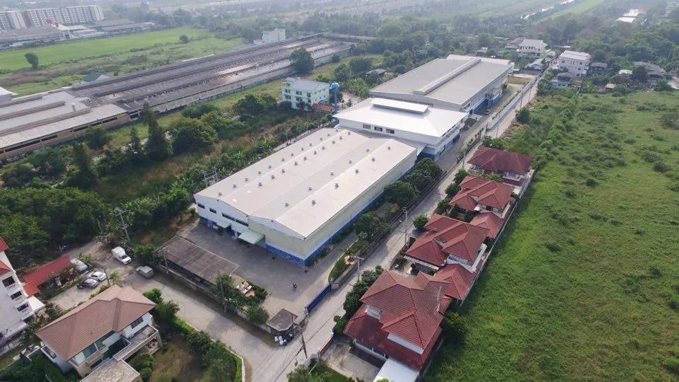 Aerial photo of a factory and housing estate