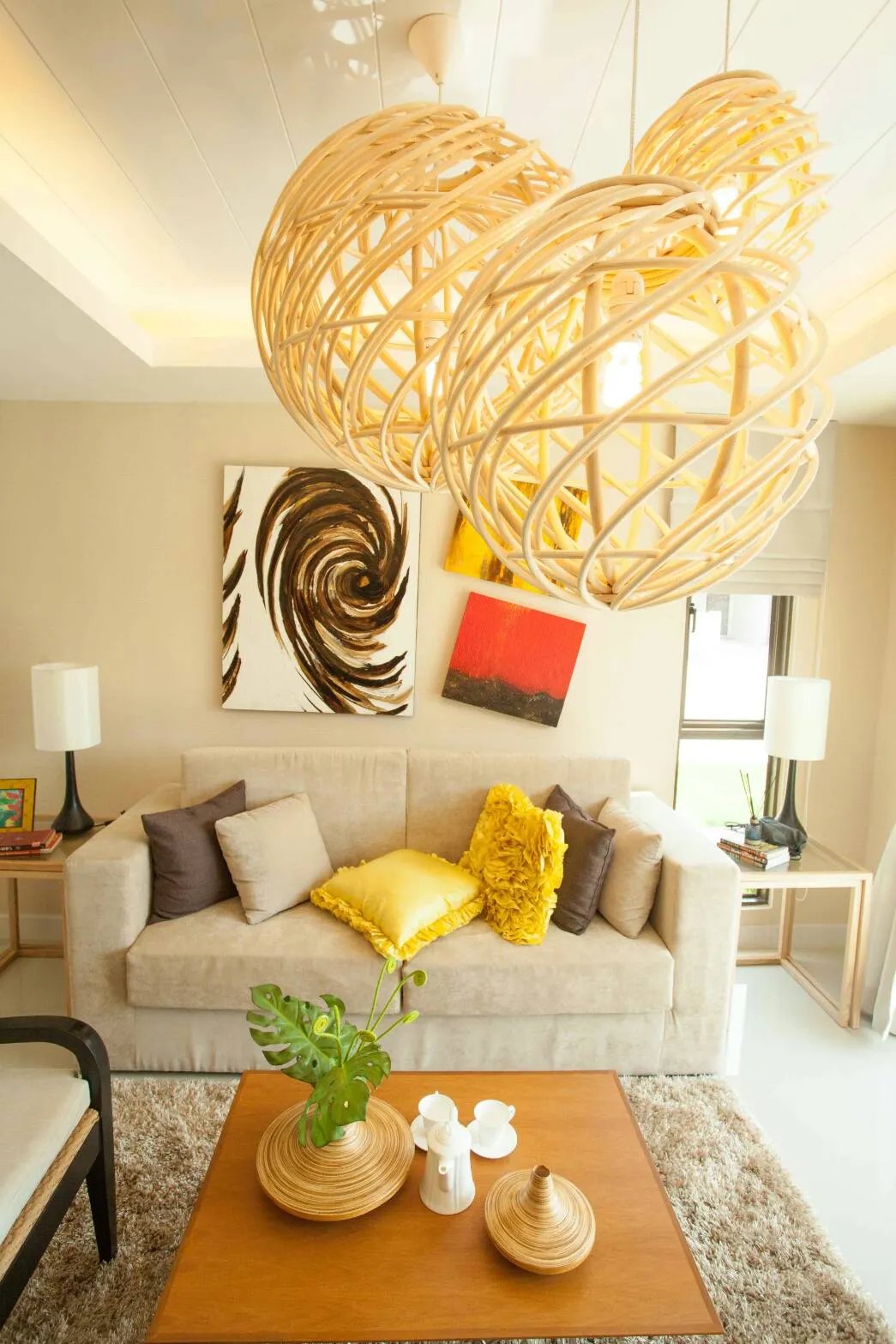 Living room with rattan pendant lamps