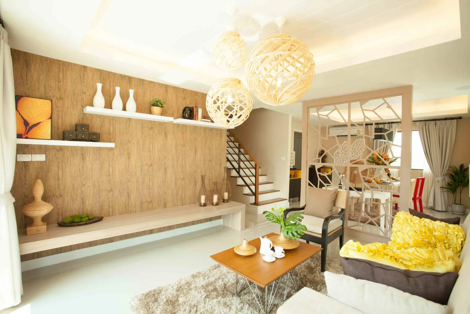 Living room interior photo with wooden wall and staircase