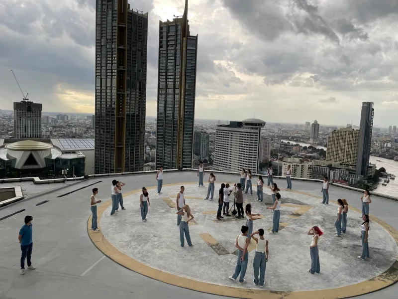 Dance shoot on a Bangkok rooftop with the city skyline behind