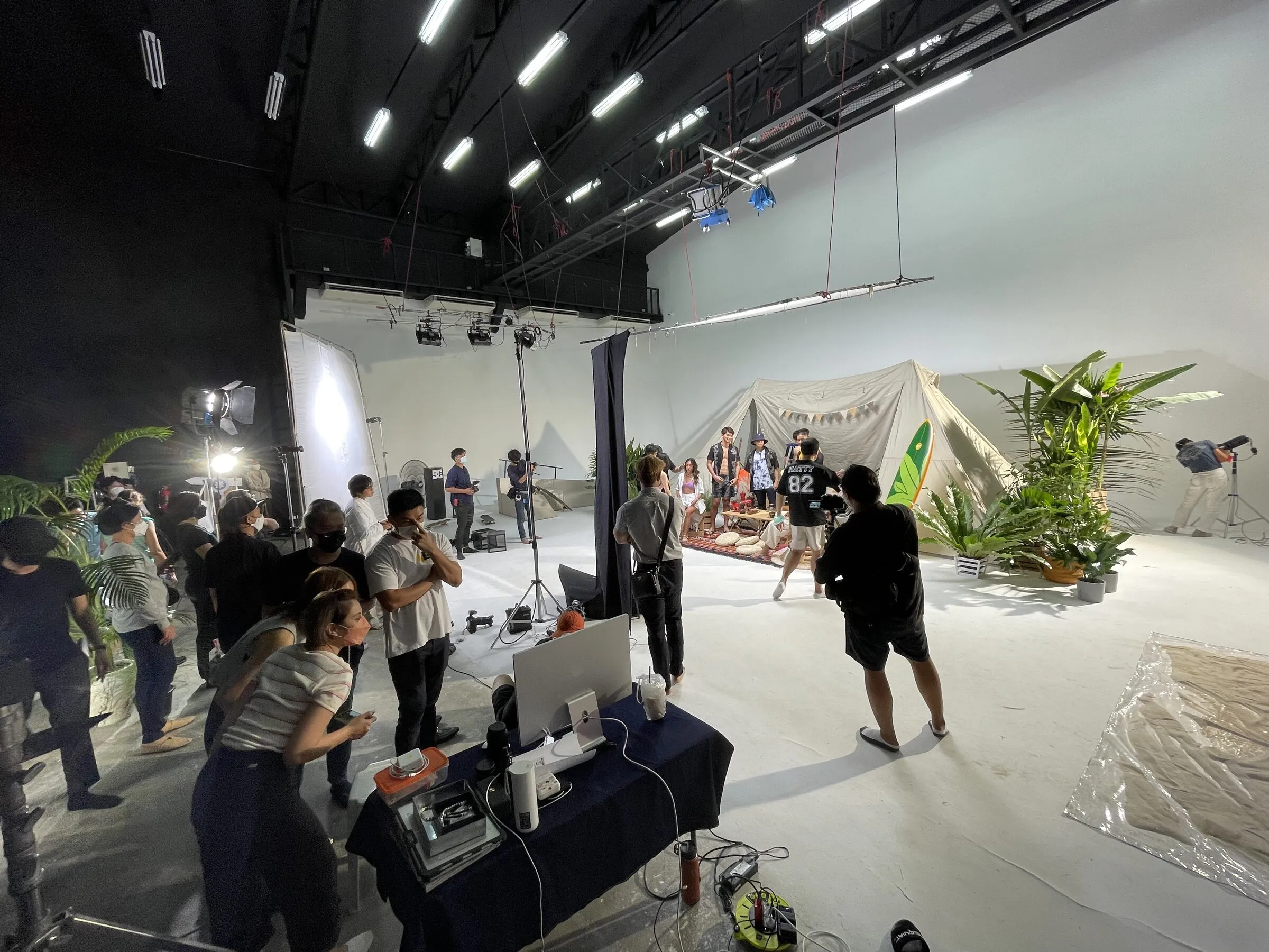 Roxy and Quiksilver shoot: studio set with a tent and plants on a white cyc