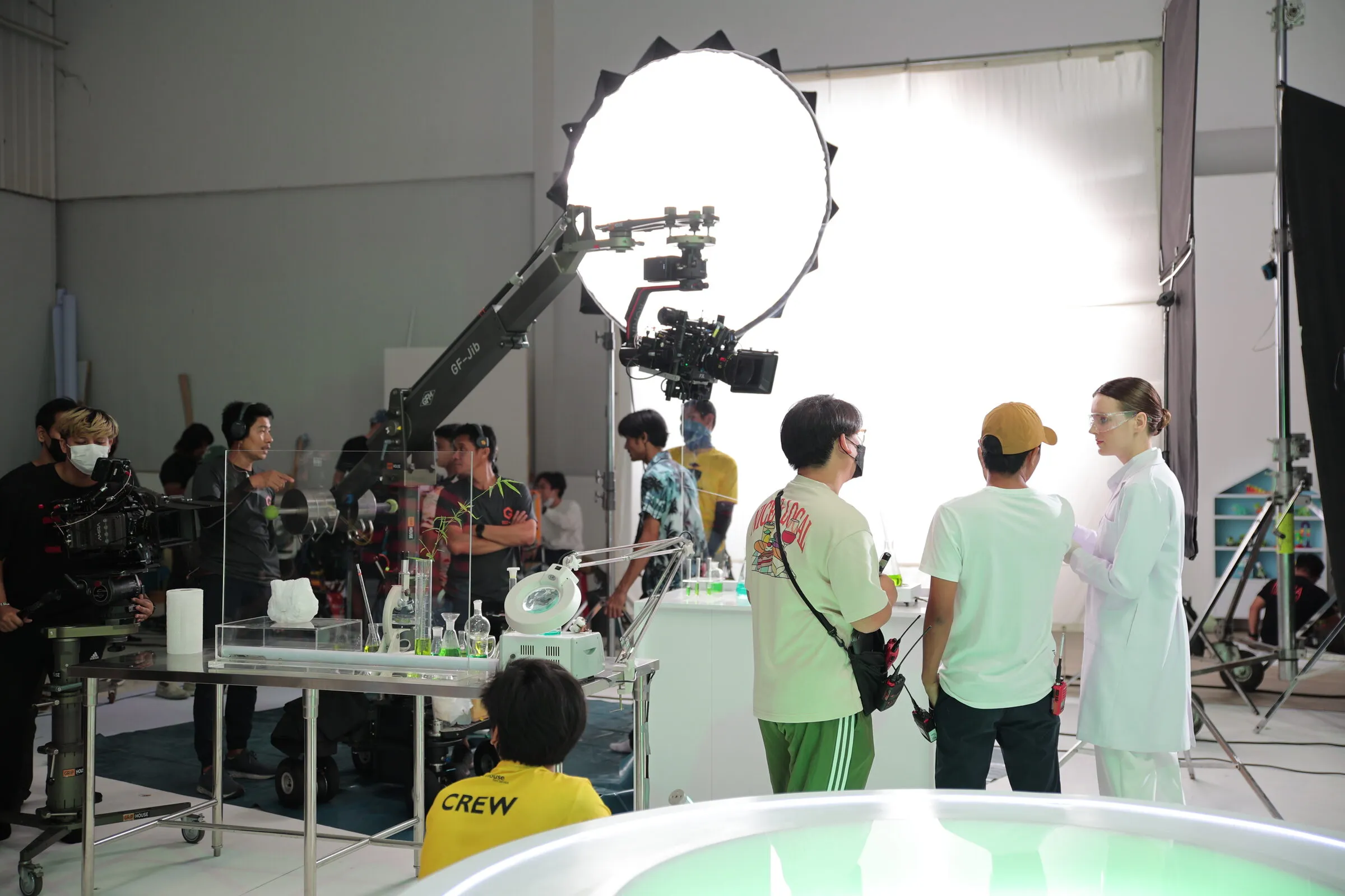 Crew preparing a studio set with a jib arm for a Molfix commercial