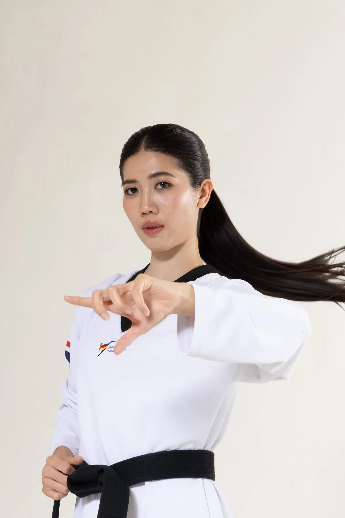 Tennis in her taekwondo uniform, ready stance