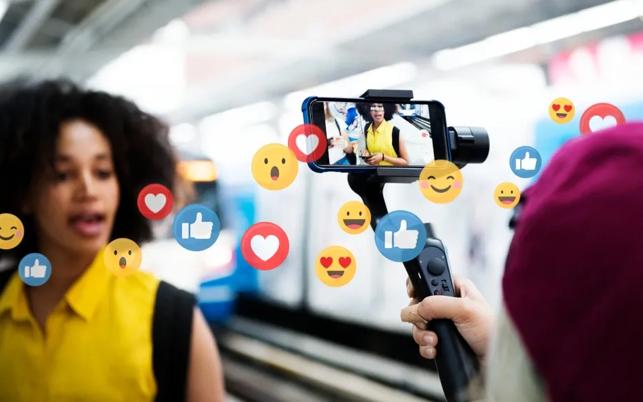Woman filming herself with a phone on a gimbal, surrounded by social media reactions
